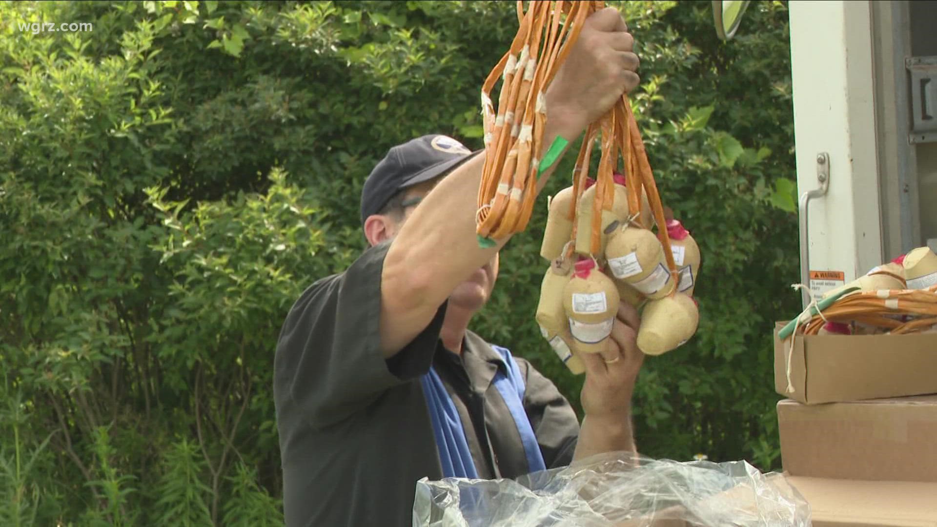 The pyrotechnic and sound teams are busy setting up for the fireworks at Kenney Field in Tonawanda.