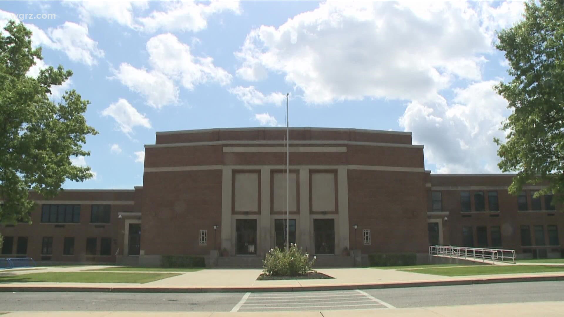 School officials found a threatening message written on a bathroom wall about the tinsel ball dance.