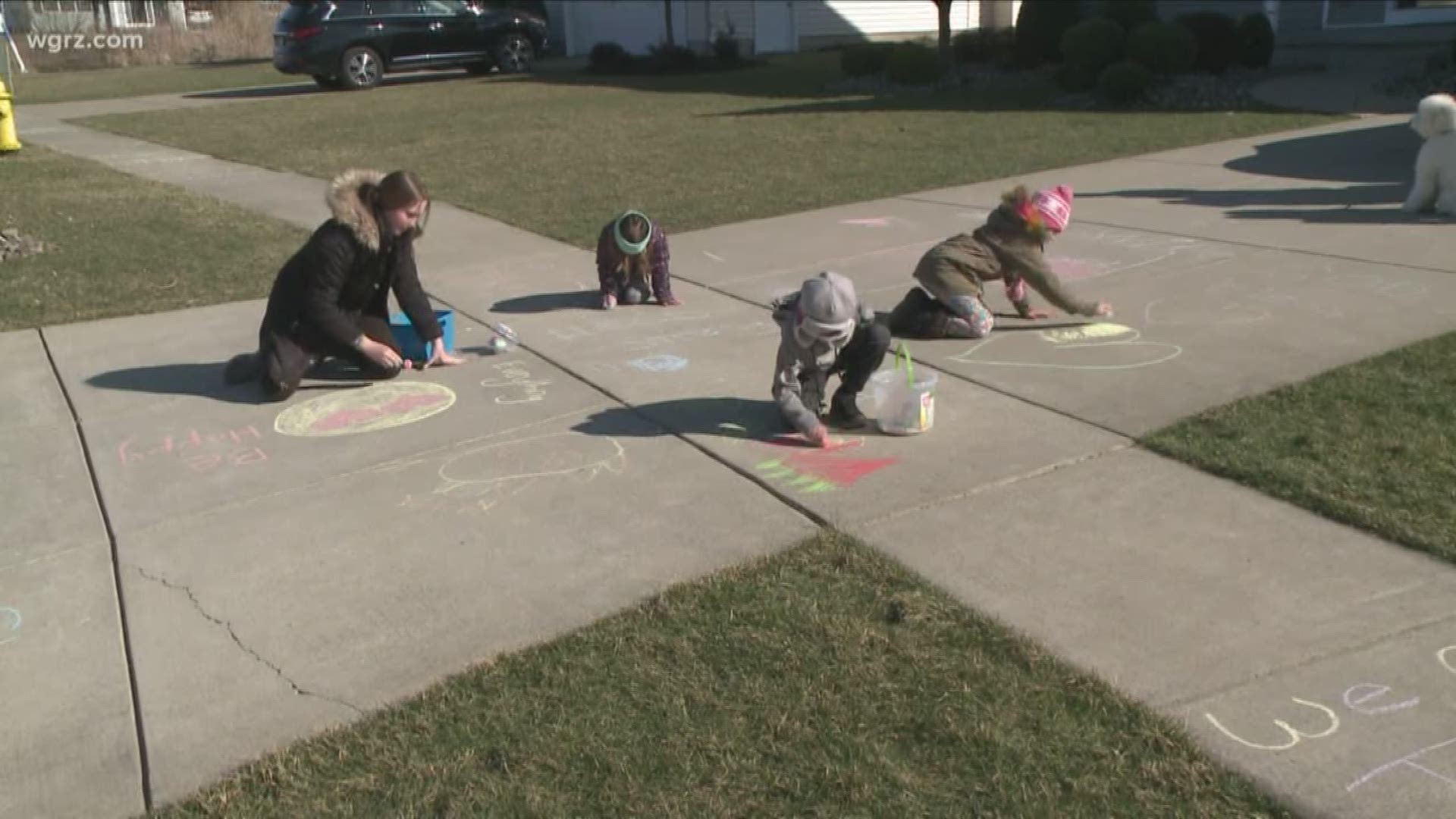 This afternoon, neighbors out in Lancaster were out drawing on the sidewalks in chalk, leaving a positive message or picture for people to look at as they passed by.