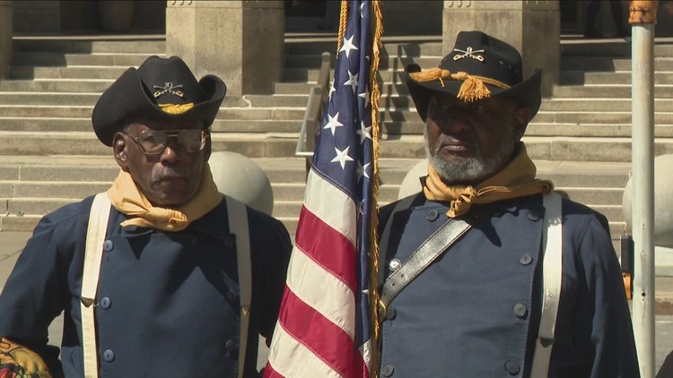 Flag raising and veteran monument in honor of African American veterans