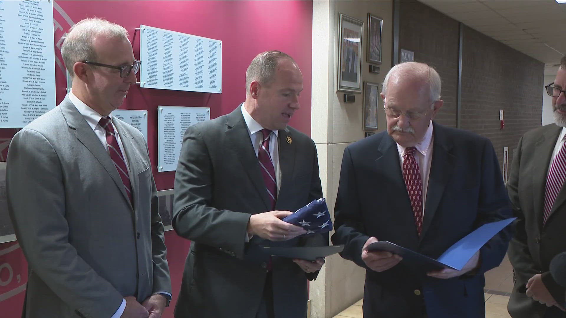 Rep. Tim Kennedy presents St. Joe's with flag