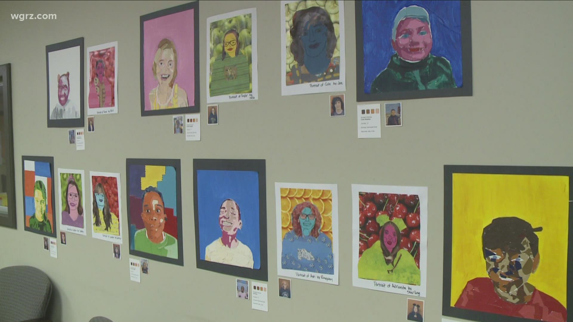 The "Love The Skin You're In" show features artwork that students contributed, inspired by artist Angelica Dass.