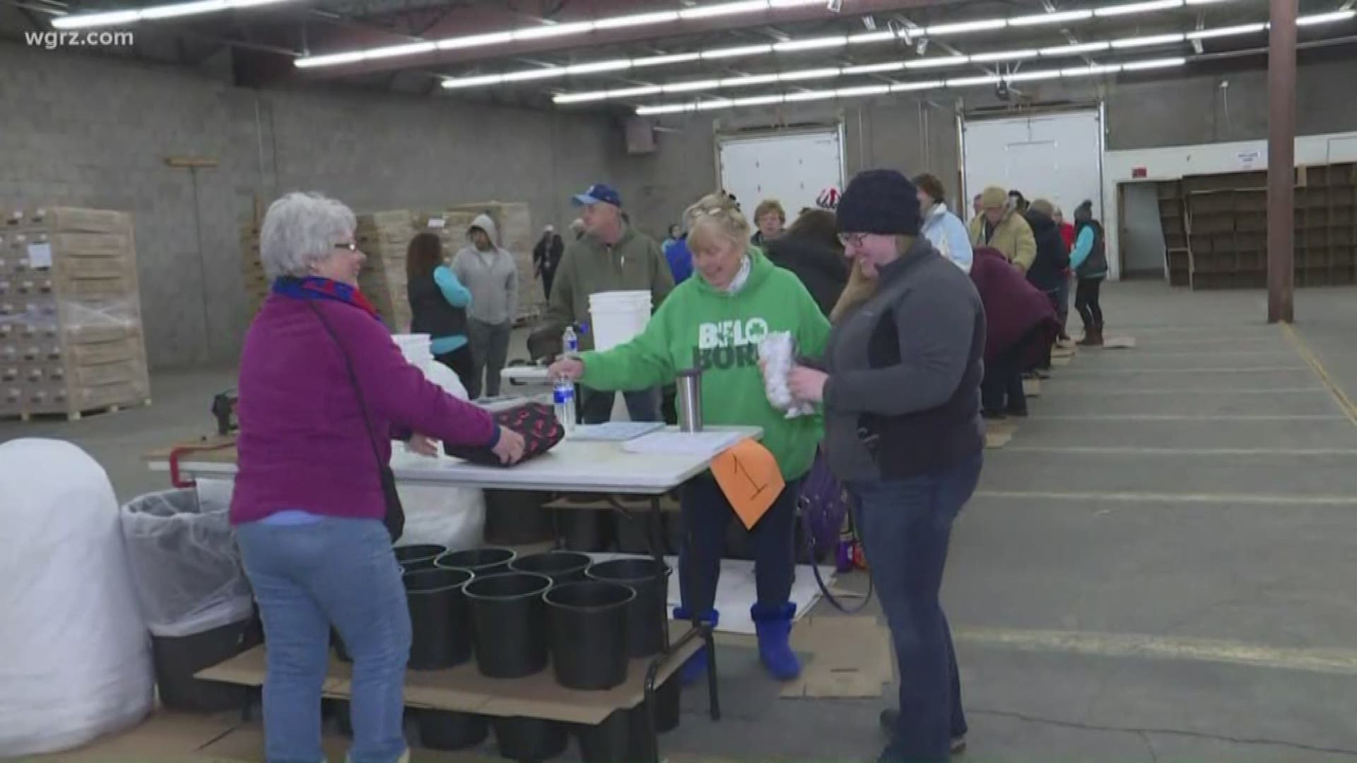 Hundreds of volunteers are spending their Saturday unloading more than 250,000 fresh flowers. They're assembling 30,000 bouquets and packing them for delivery.