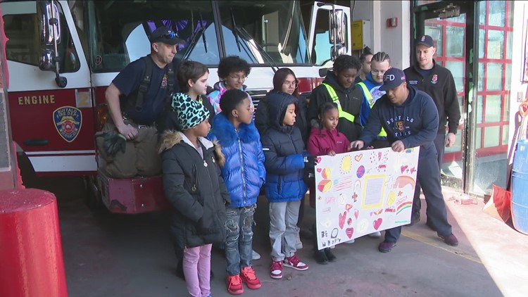 Students at Elmwood Village Charter School deliver letters to Engine 2