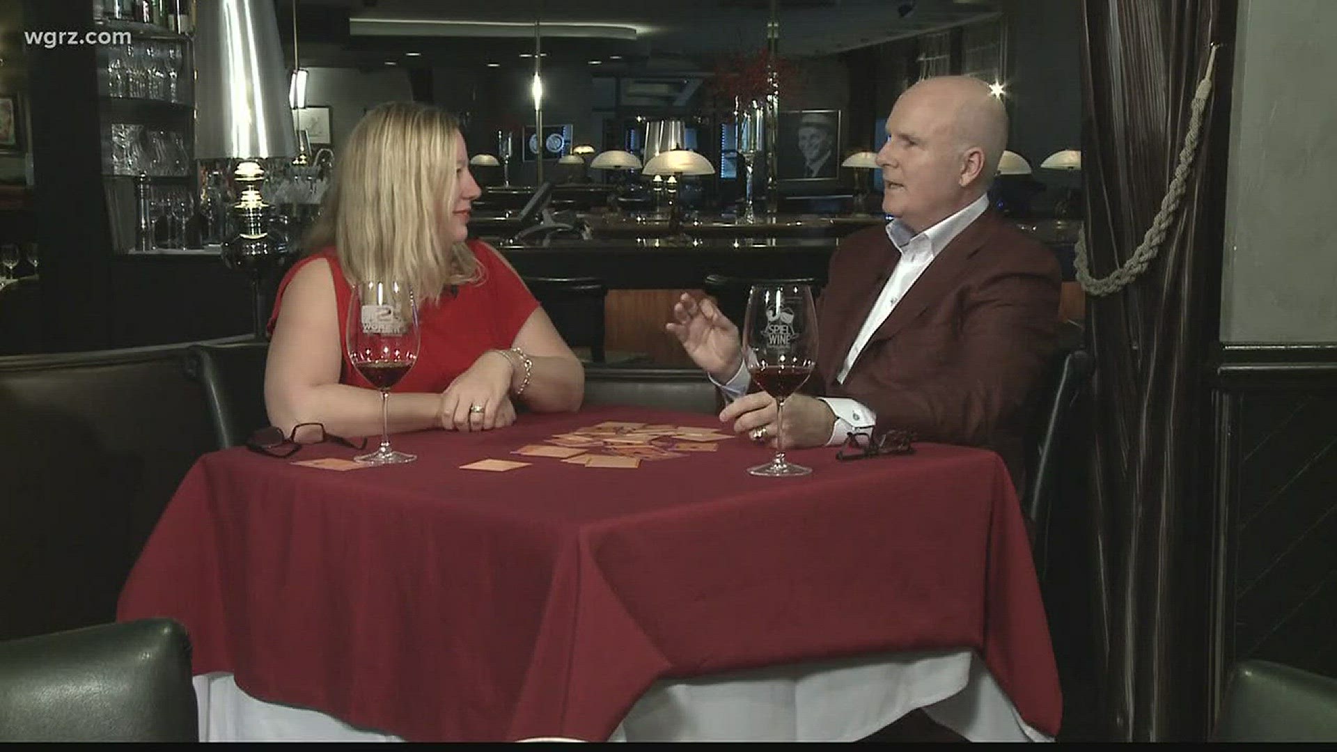 Kevin plays a wine card game with Donna Schlosser-Long