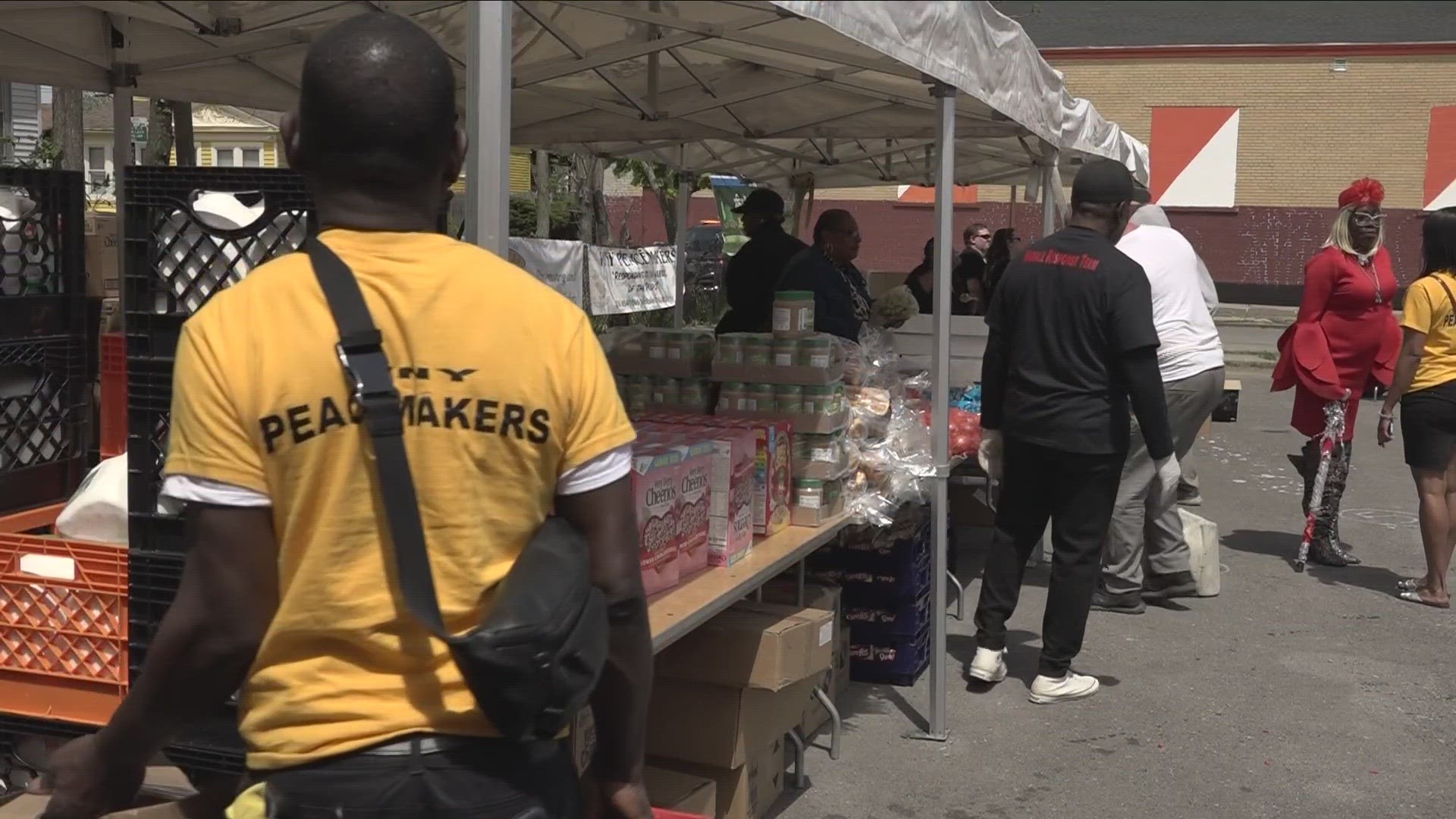 Tops Market on Jefferson was closed on Sunday. The FATHERS organization held a food giveaway across the street from the store.