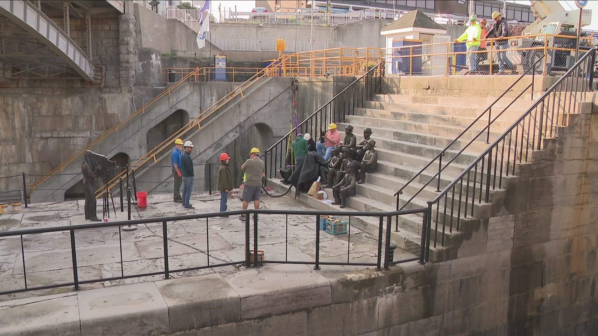 Six more sculptures went in Friday, completing the display of 14 life-sized bronze statues right next to the Lockport locks.