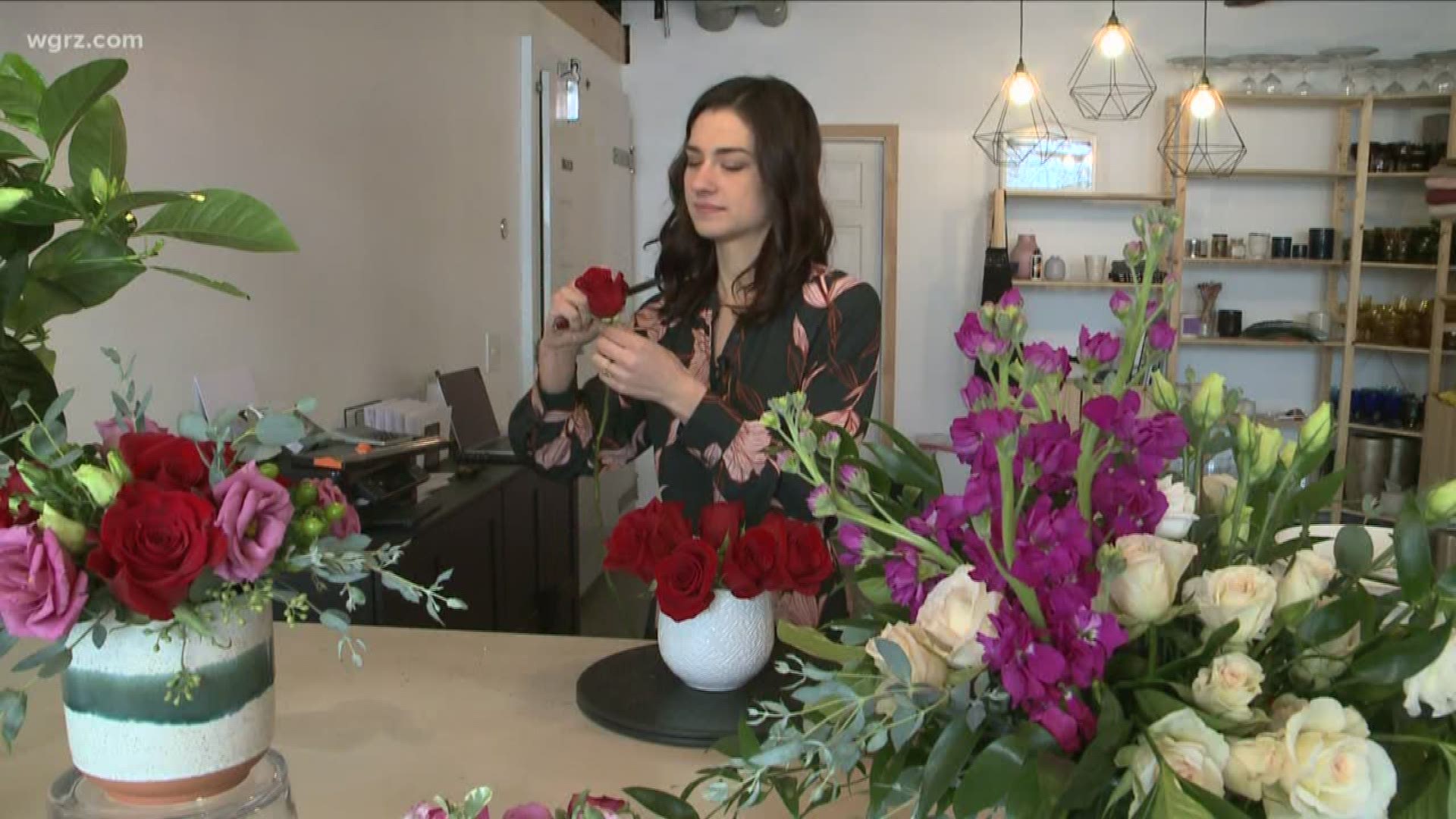Behind the flower arrangements with owner Kayla