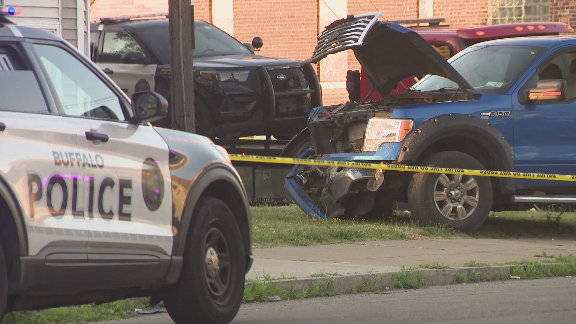 Two police officers and the driver of the other car involved were taken to ECMC with non-life threatening injuries. 