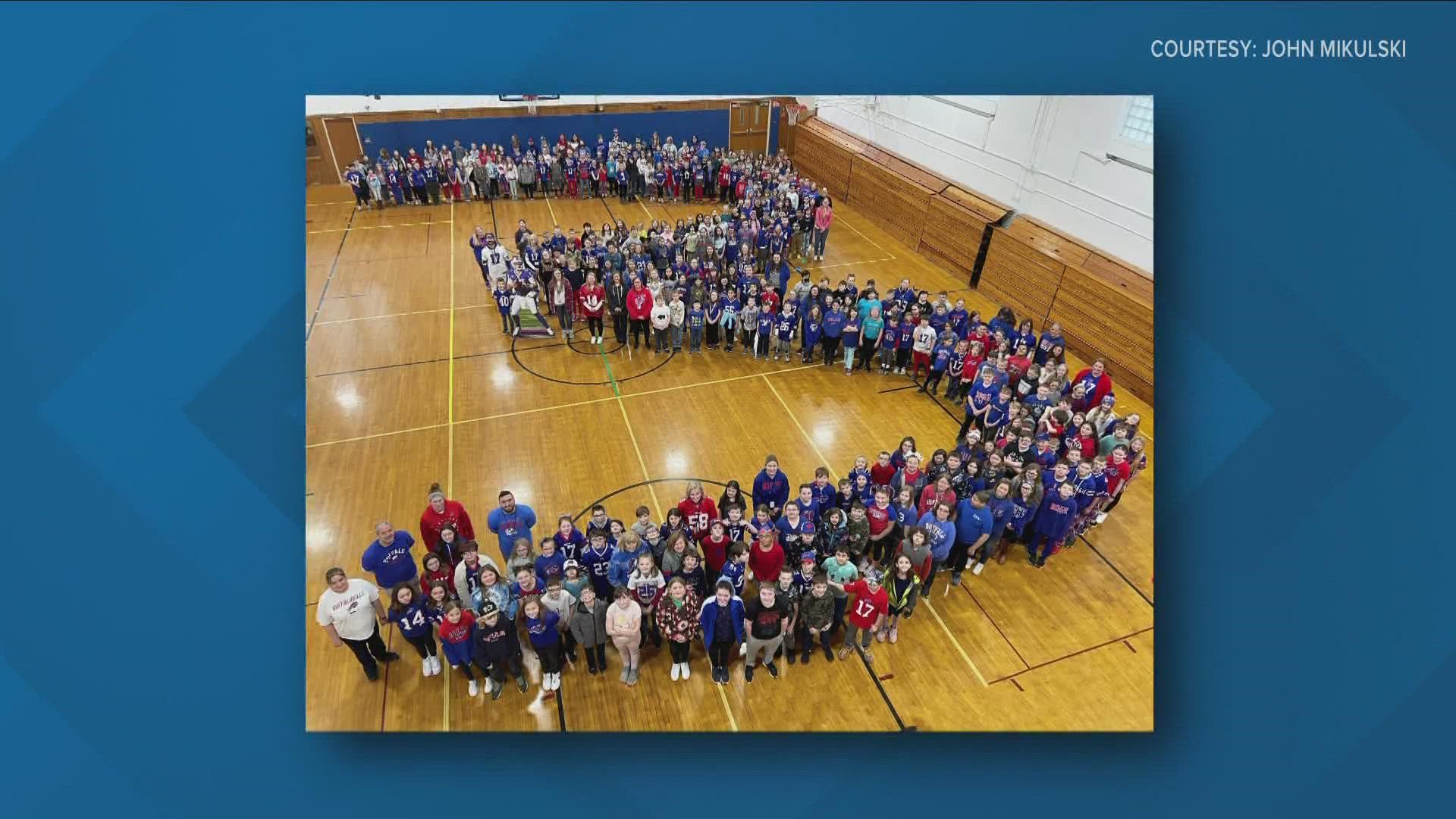 Alden Intermediate School children formed a huge number three to be photographed, all wearing their Bills gear.