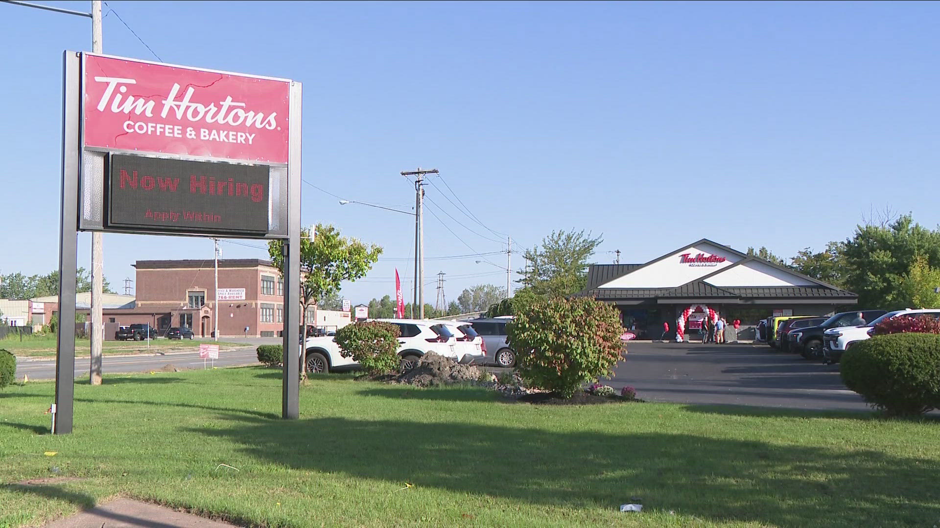 The company celebrated the grand opening Friday, and people wasted no time lining up at the drive-thru to place their orders.