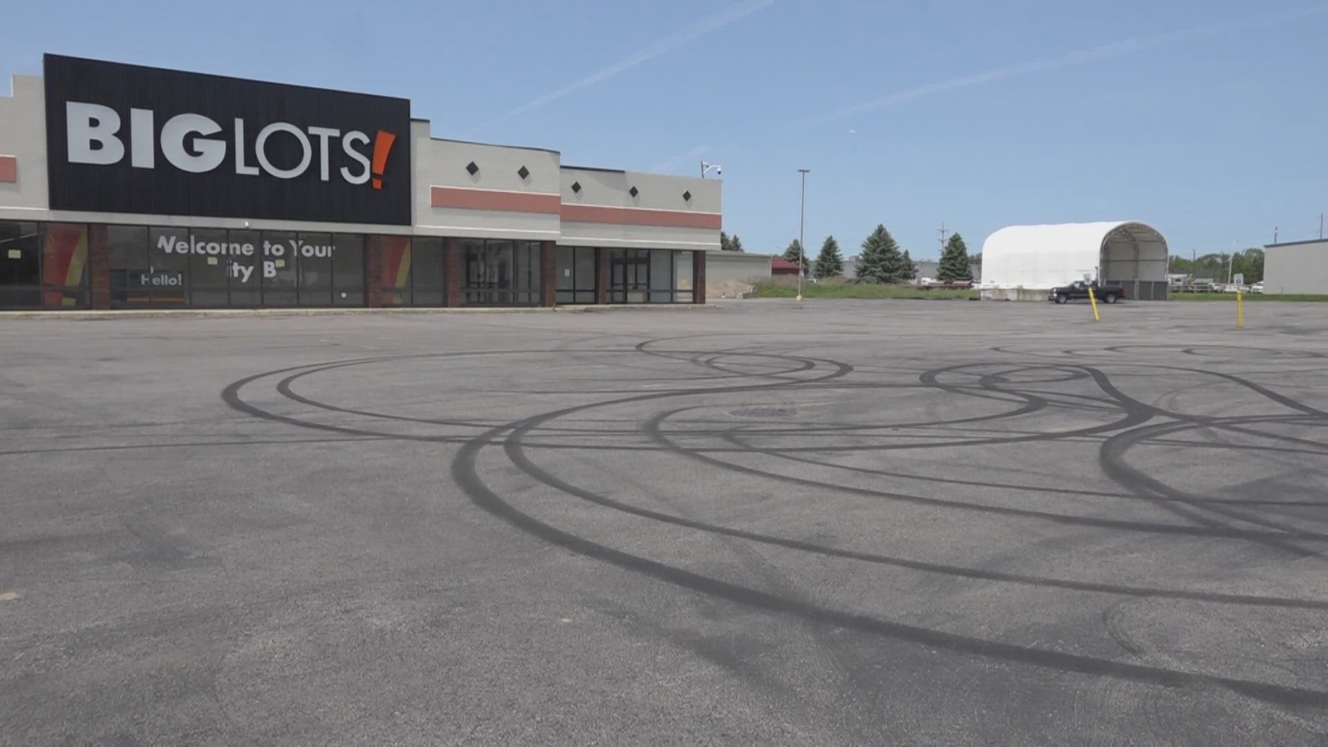 Surveillance footage shows cars doing burnouts in the parking lot, and damaging the property. 