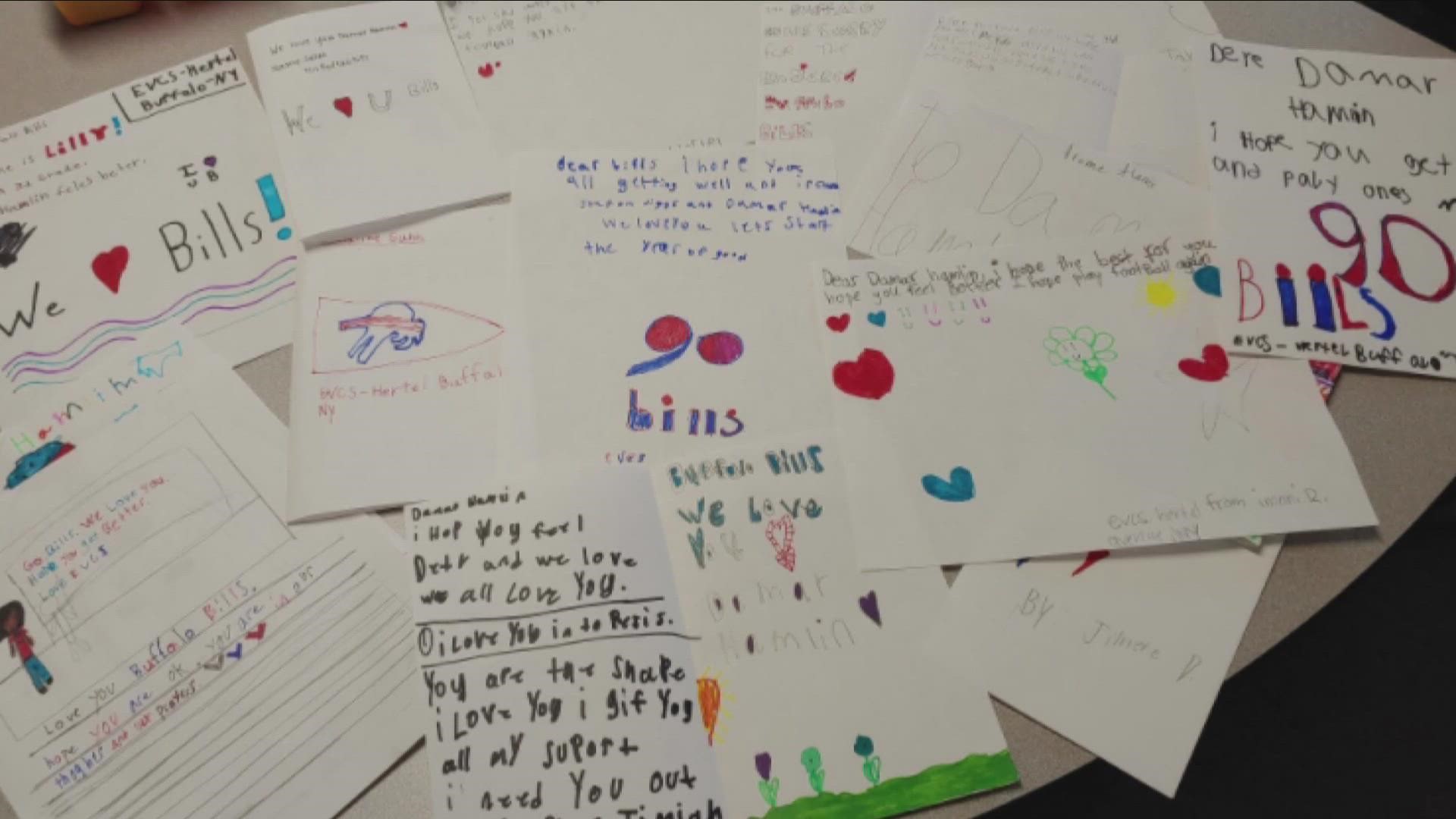 Kids from Elmwood Village Charter School on Hertel write cards to Damar Hamlin