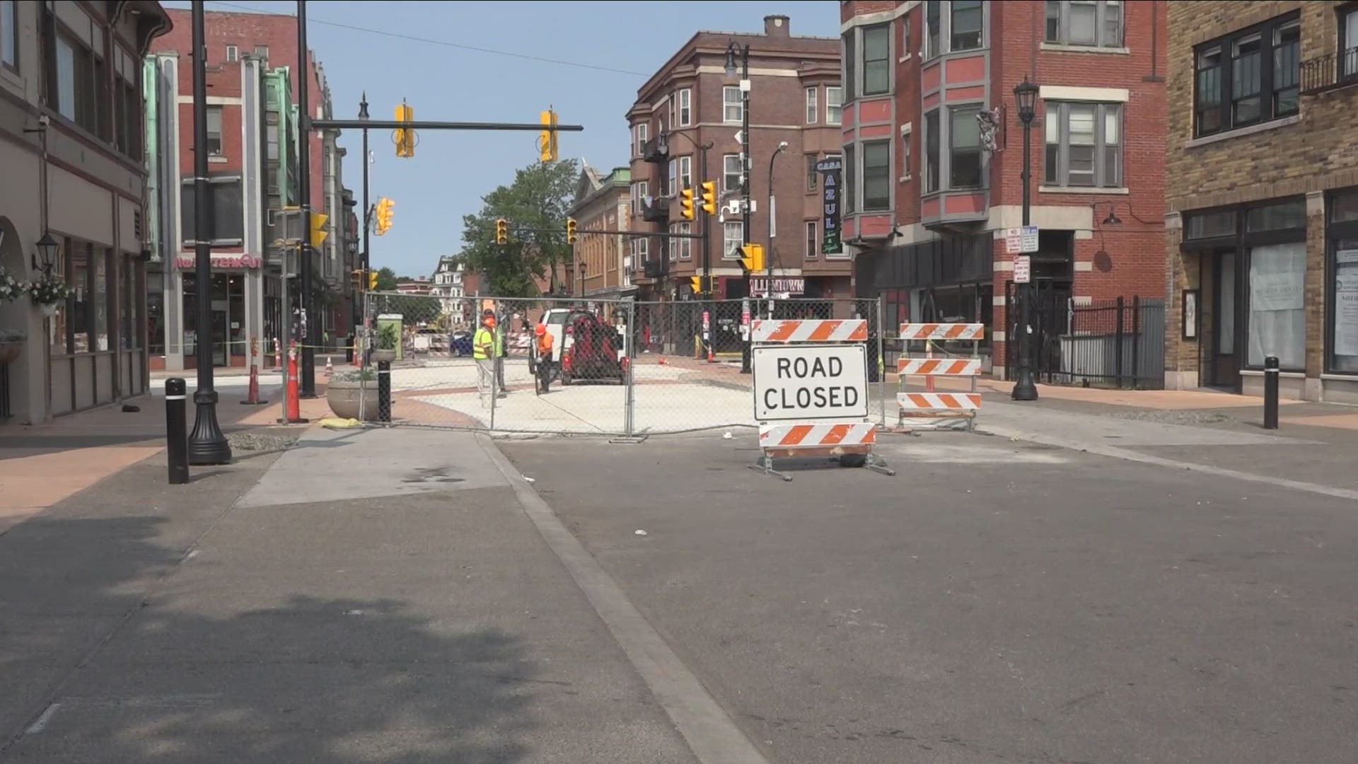 YET ANOTHER WEEK, CHAIN LINK FENCING...ROAD CLOSURE SIGNS...AND YELLOW TAPE LINES THE INTERSECTION AT ALLEN STREET AND ELMWOOD AVENUE...