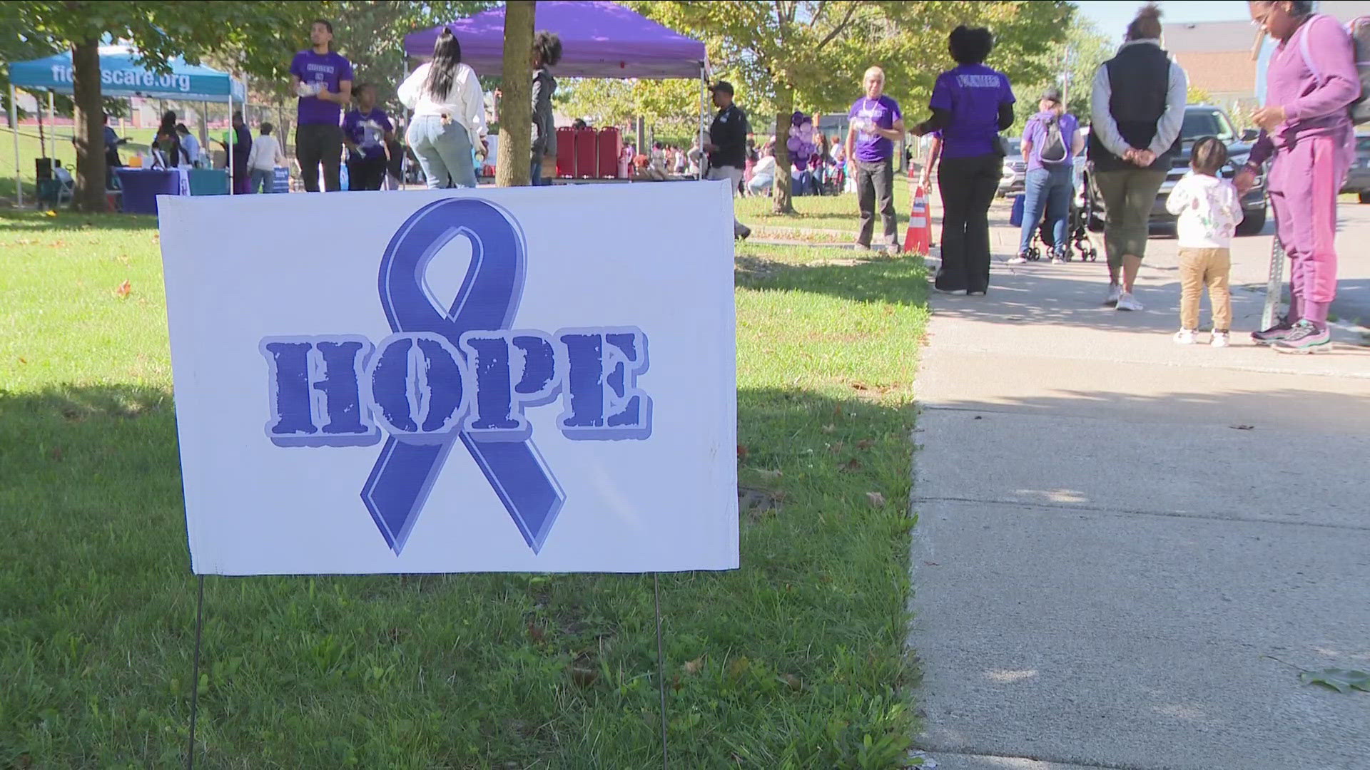 Participants were encouraged to wear purple, a color worn in solidarity with domestic violence victims.