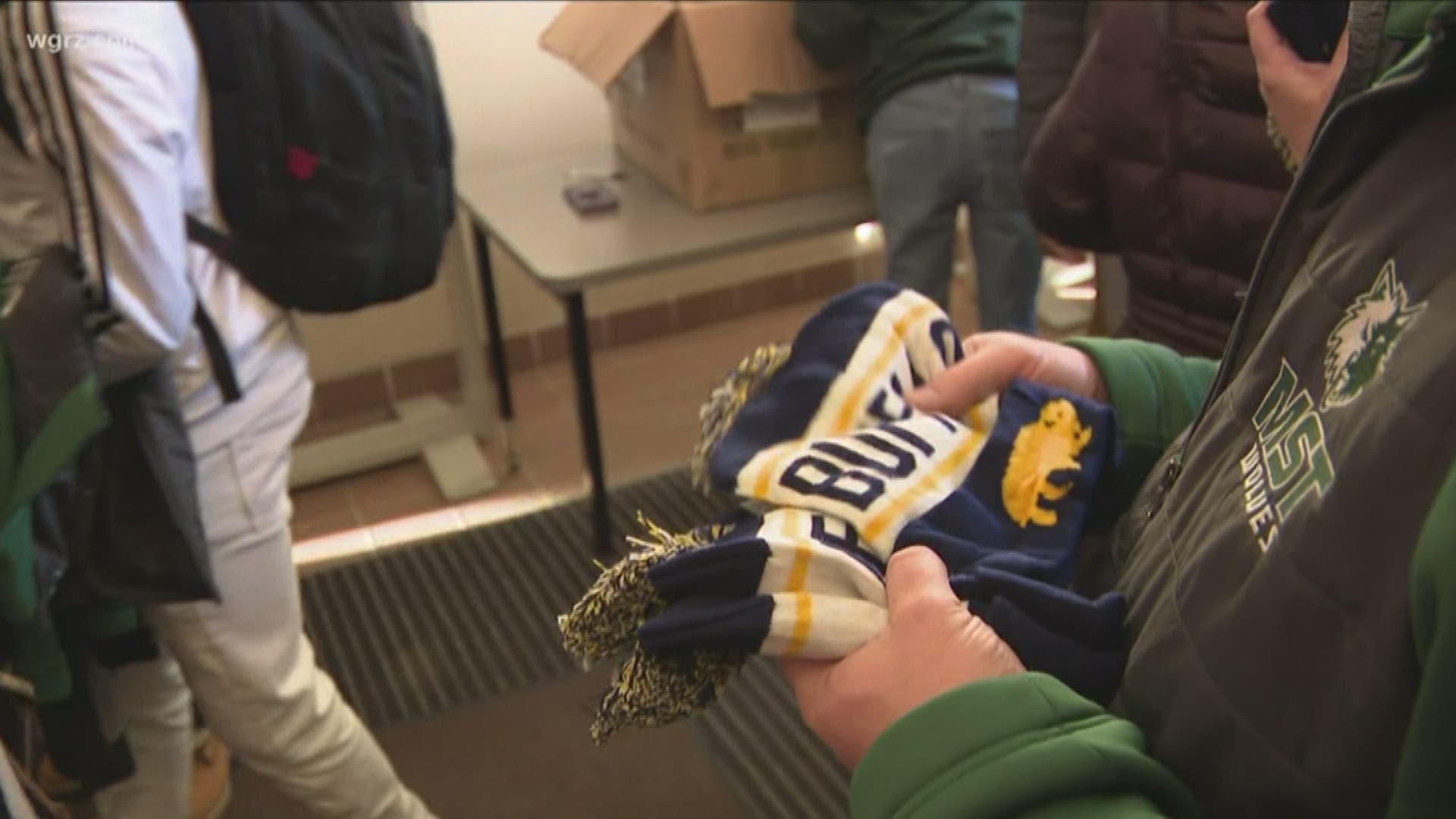 The on-line retailer donated close to five hundred Buffalo-themed hats that teachers and staff passed out as the kids headed out on this very cold afternoon.