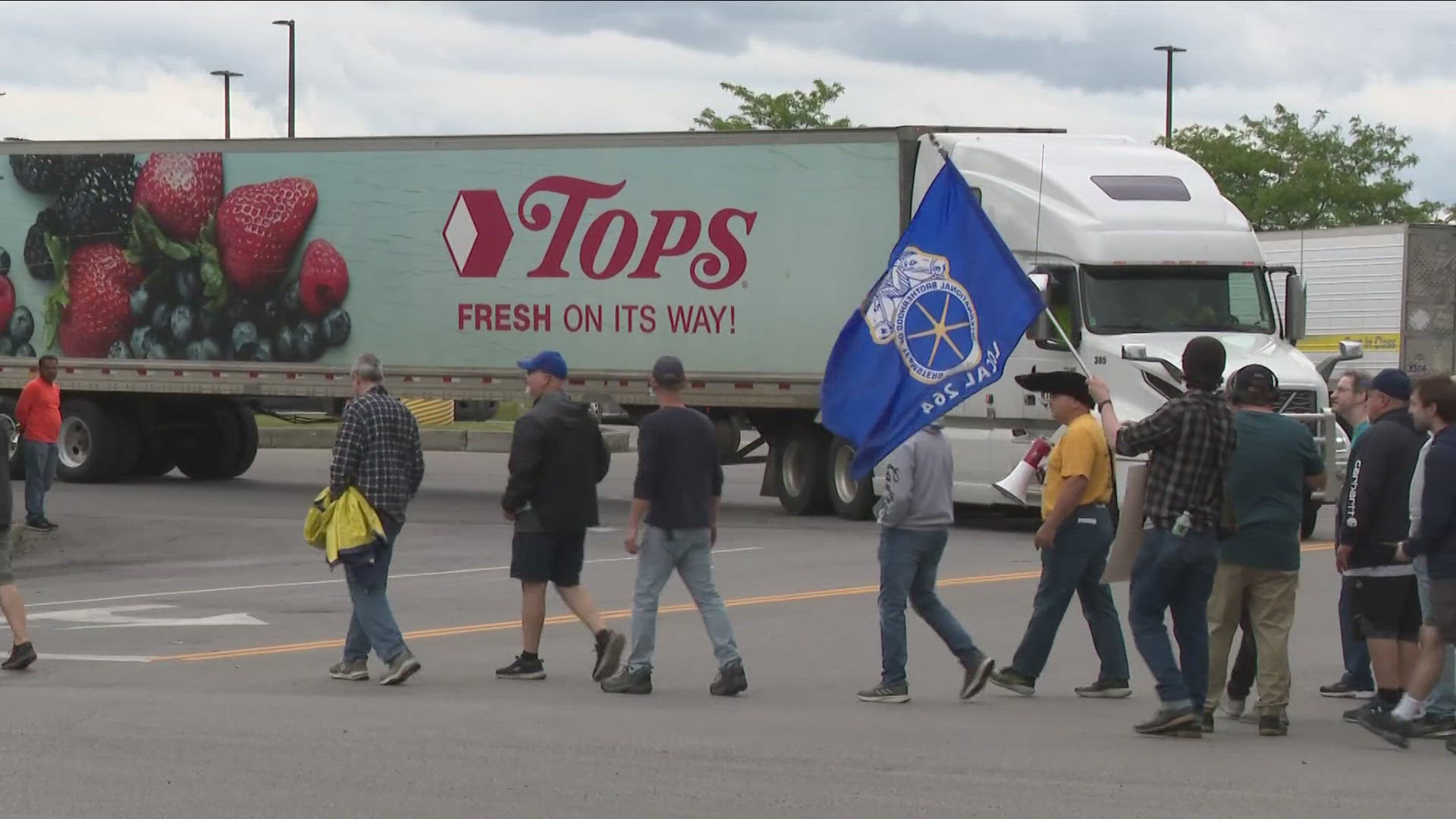 The strike began Friday morning after Tops warehouse workers rejected the previous contract offer. A tentative 4-year agreement will go to a vote on Saturday.