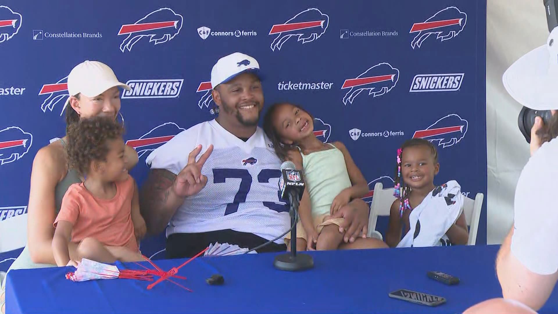Dion Dawkins talks to the media at Bills' training camp and brings the family along.