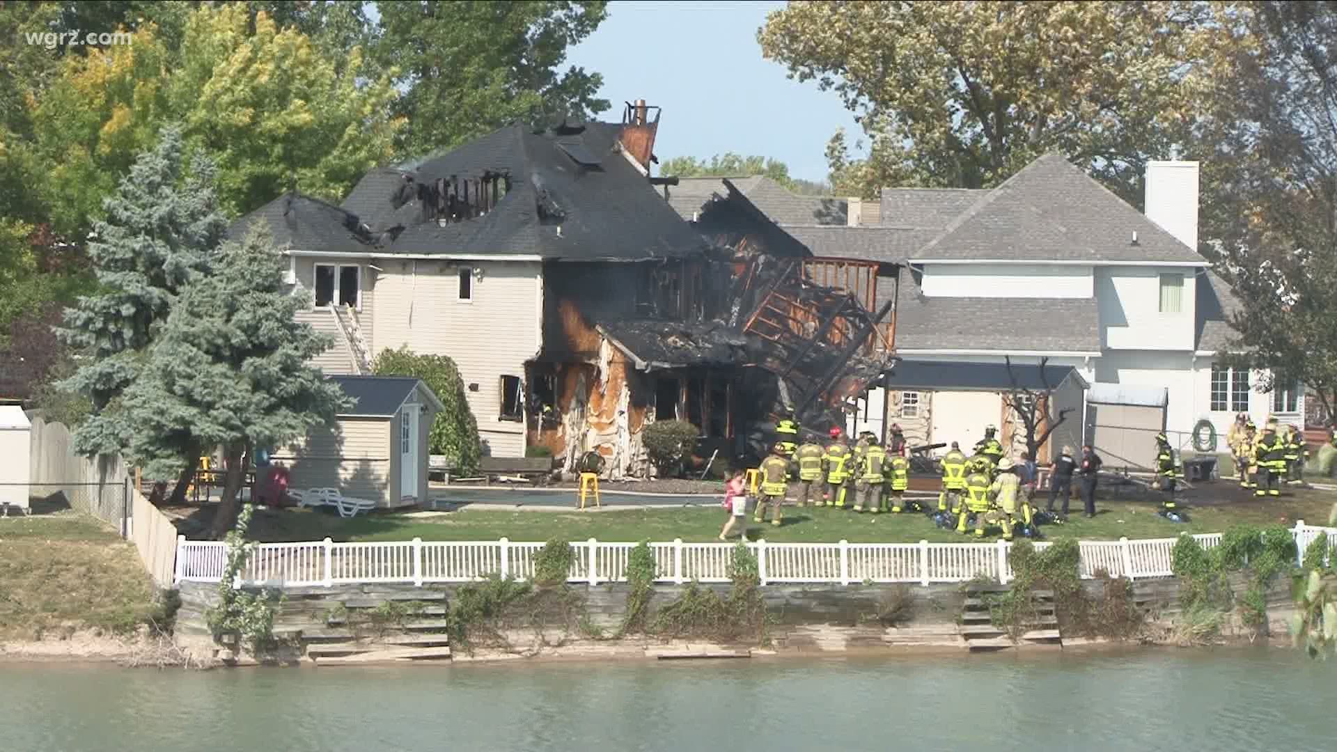 Investigators are looking into the cause of a two-alarm house fire on Button Bush Court.