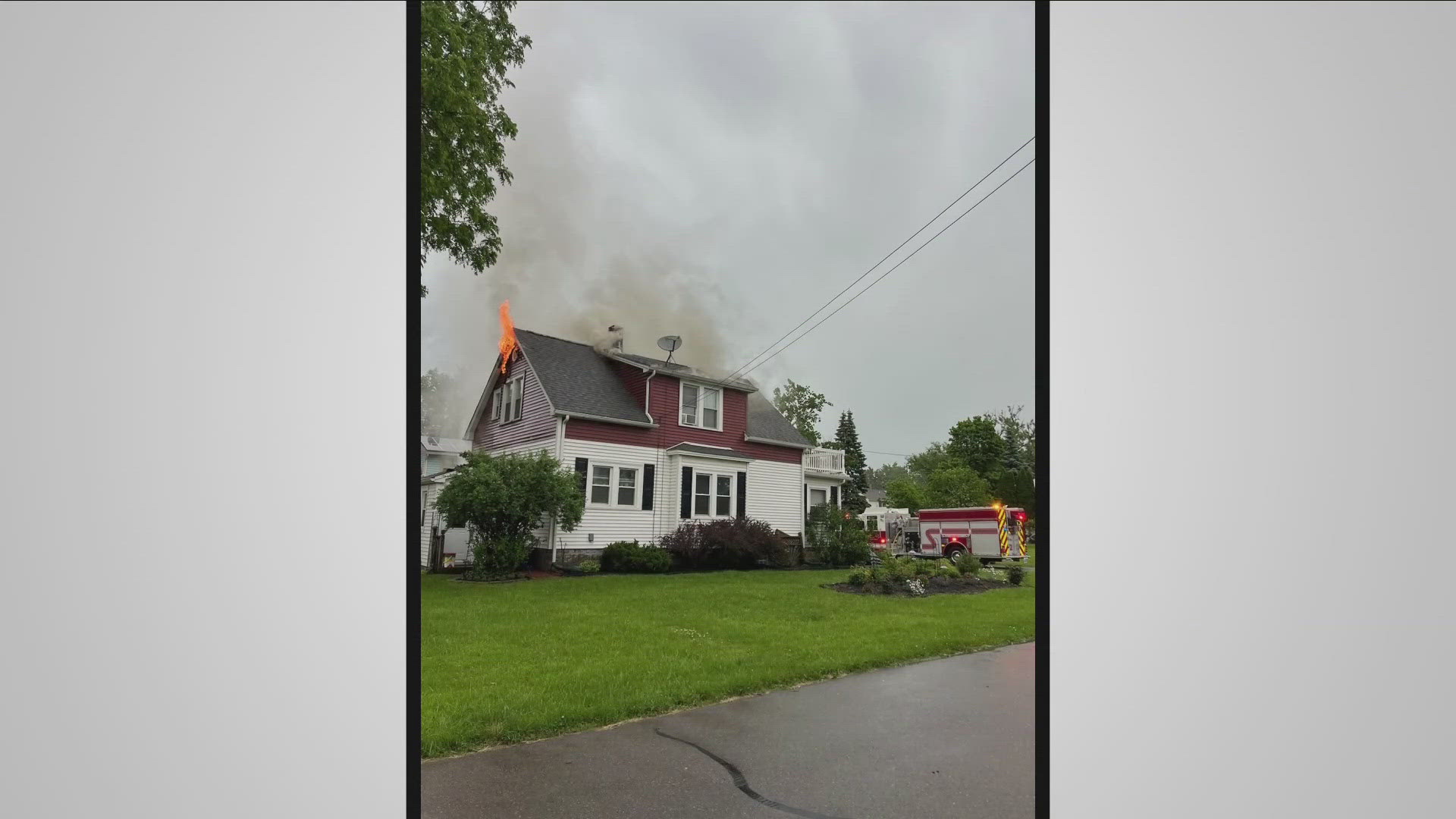 A neighbor shot dramatic video of the moment the Holland Avenue house was struck by lightning during Wednesday's storm in Hamburg.