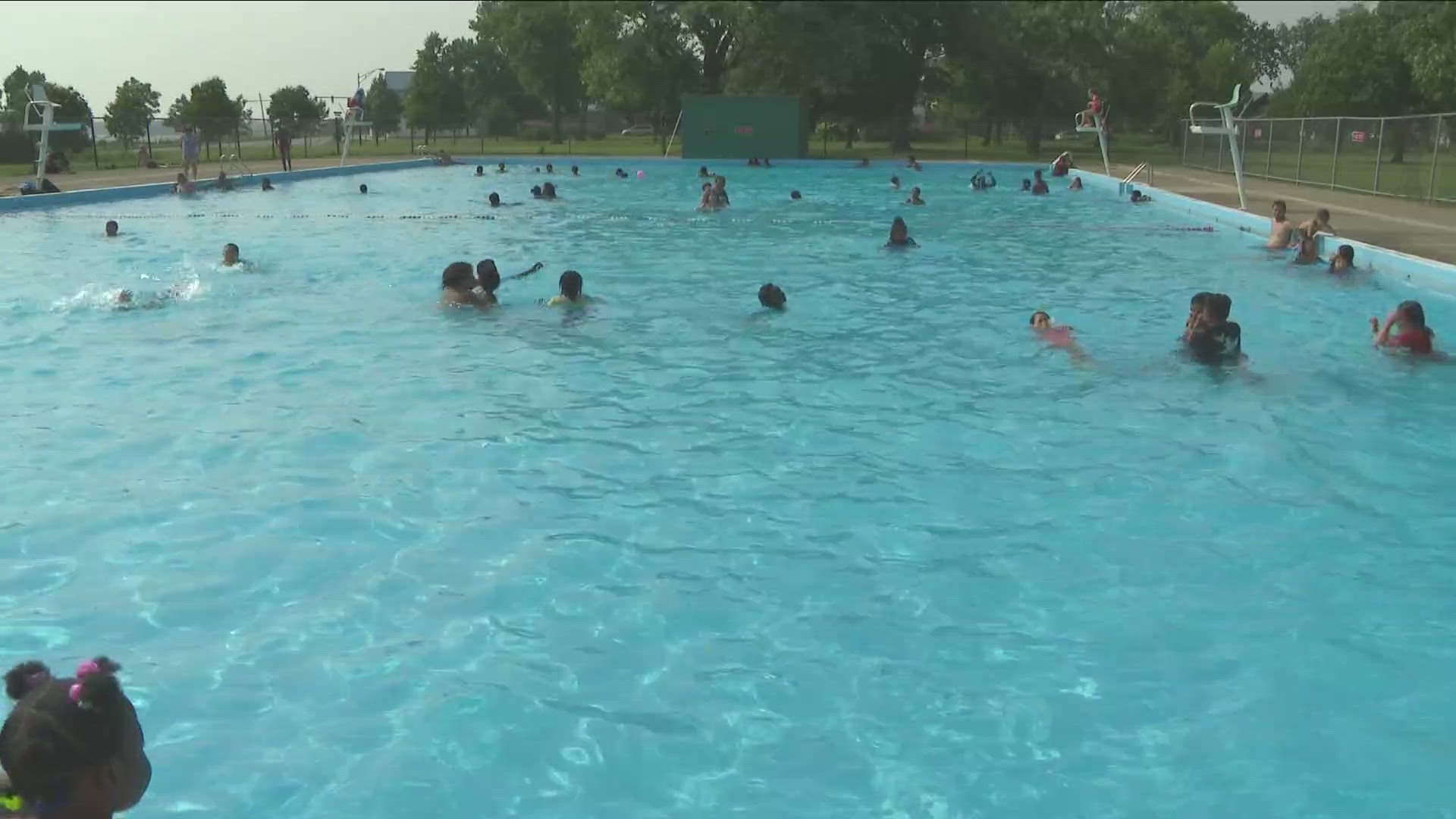 Officials say an unknown culprit threw a picnic table and garbage in the Riverside Park pool.