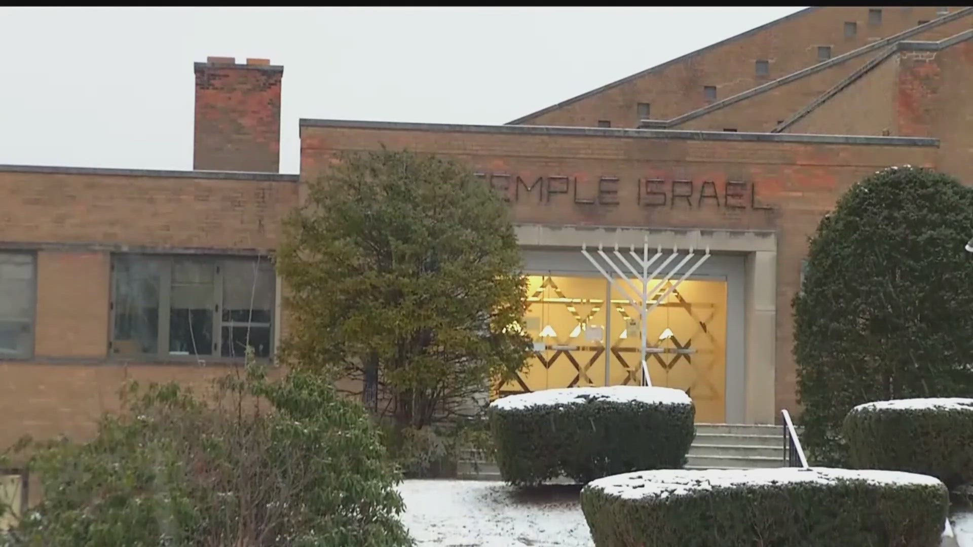 The shots were fired outside of Temple Israel just before 2 p.m. and a 28-year-old suspect was in custody, an Albany police spokesperson said.