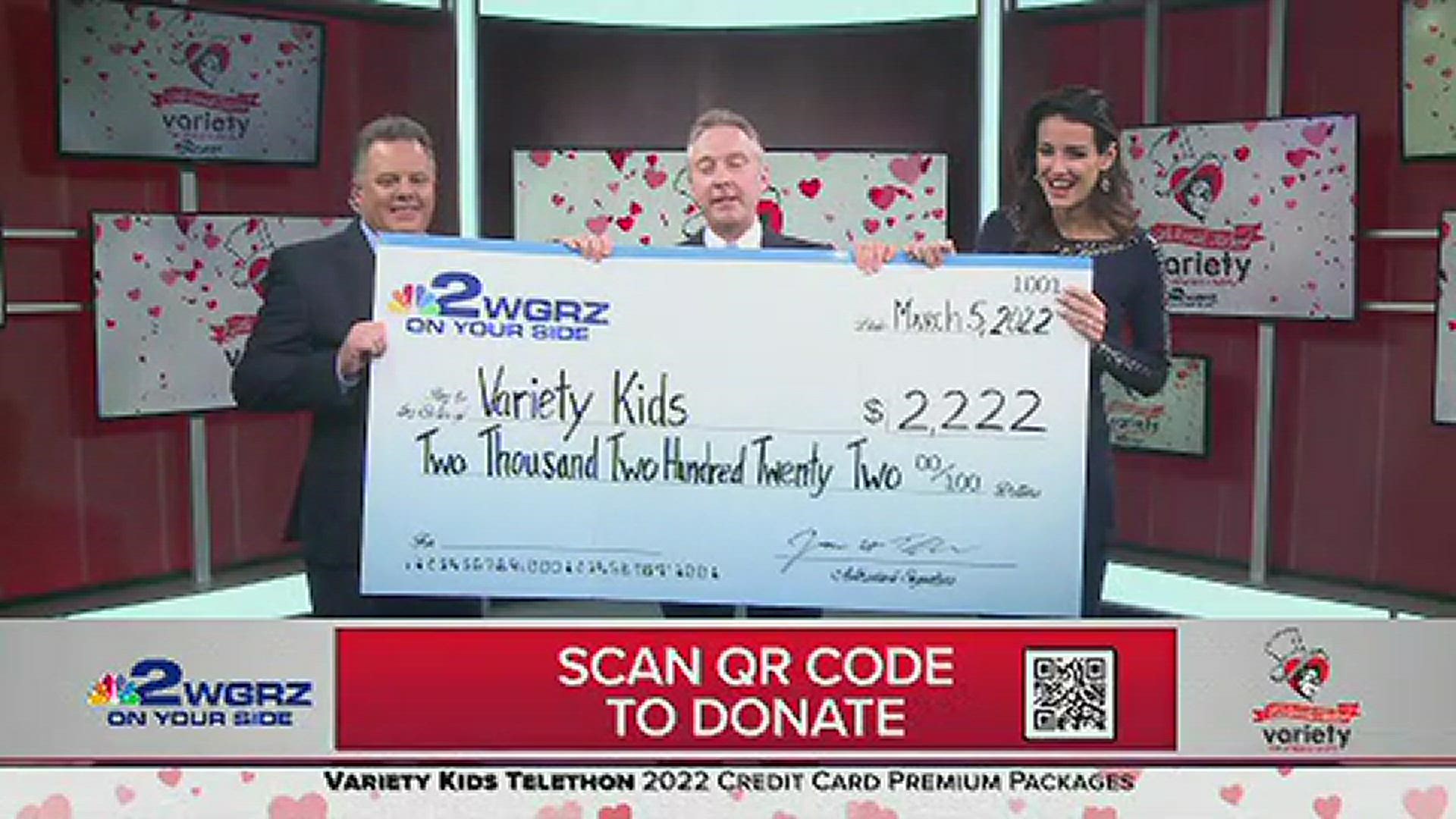 Let's dance: Channel 2 General Manager Jim Toellner and Chief Meteorologist Patrick Hammer celebrate Variety Kids Telethon donations.