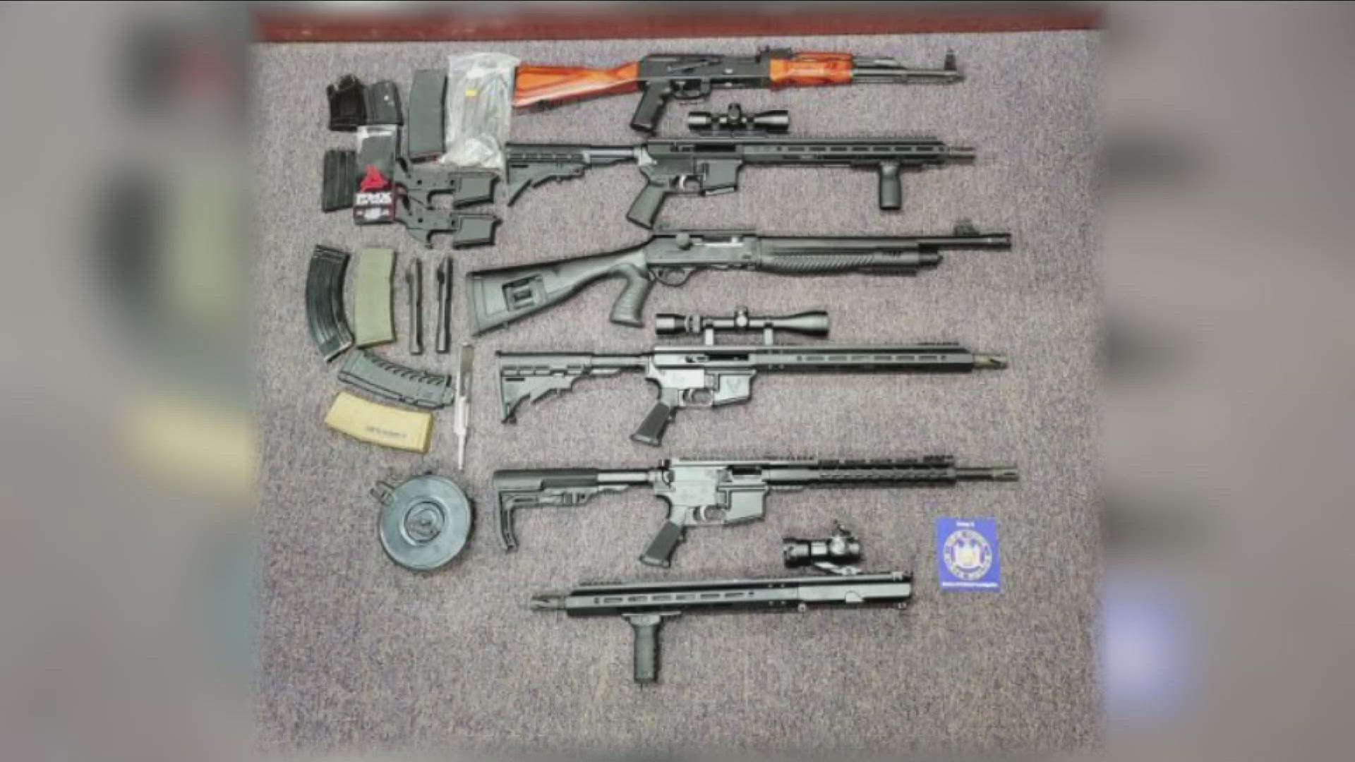 Troopers said a search warrant at his home turned up 4 assault weapons and 8  high-capacity magazines.