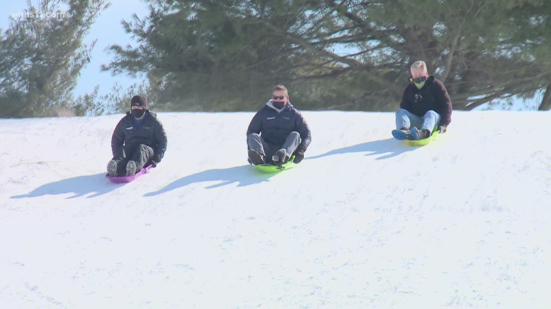 WHAS11 NightTeam members Doug Proffitt, Ben Pine and Kent Spencer took the challenge of sledding down the biggest hill at Cherokee Park.