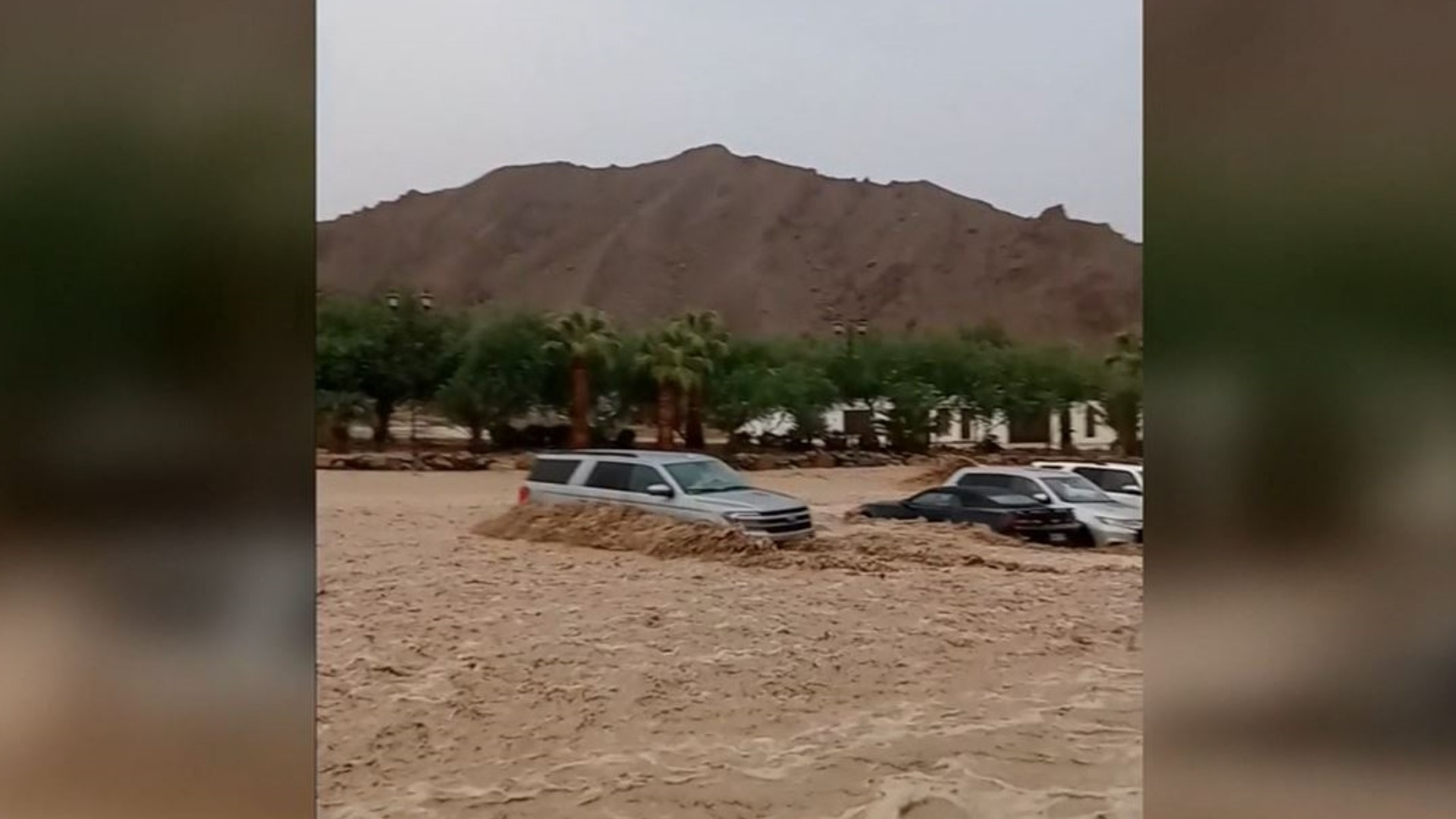 Flooding overtook several cars in California's Death Valley amid record floods that have stranded more than 1,000 people.